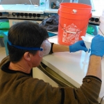 Kai Staats conducting a barley plant growth experiment at B2, 2019