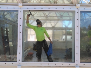 Greg Spencer applying window tint to SAM at Biosphere 2