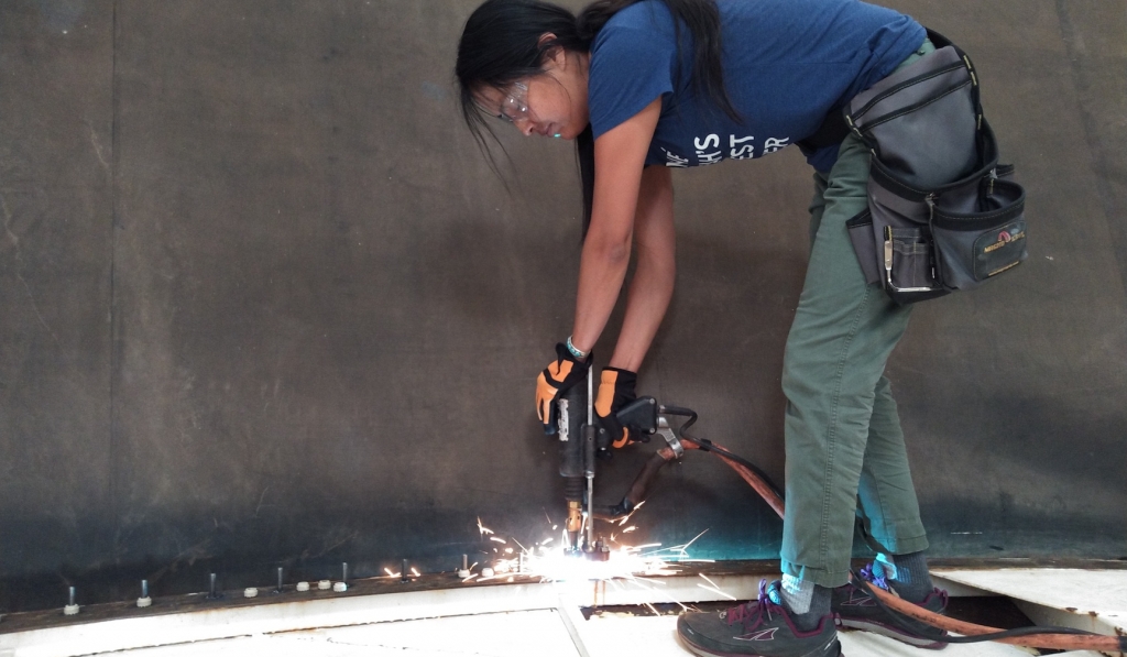 Colleen Cooley using a stud welder at SAM, Biosphere 2