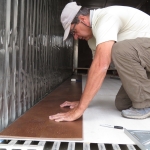 John Z. laying the second row of cork flooring at SAM, Biosphere 2