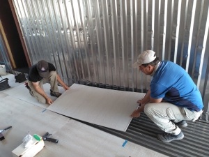 Kai, John Z laying backer board over the aluminum rails at SAM, Biosphere 2