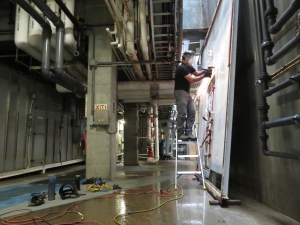 Nathan Schmit, Kai Staats salvaging an original pressure door from Biosphere 2 for SAM.