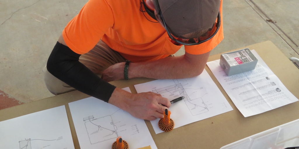 Matthias Beach studying the fire detection system wiring diagrams for SAM at Biosphere 2