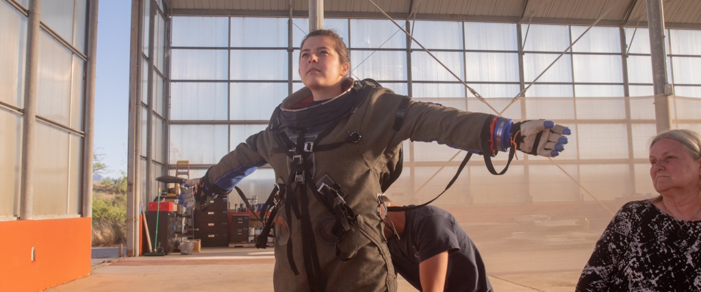 Cassandra Klos, Crew Commander and photographer, being fitted for a pressure suit at SAM, Biosphere 2 - photo by Cassandra Klos (@cassandraklos)