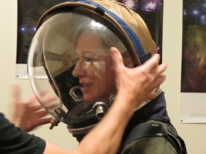 Keridwen Cornelius donning a pressure suit for the first time, during SAM training with Trent Tresch, Biosphere 2