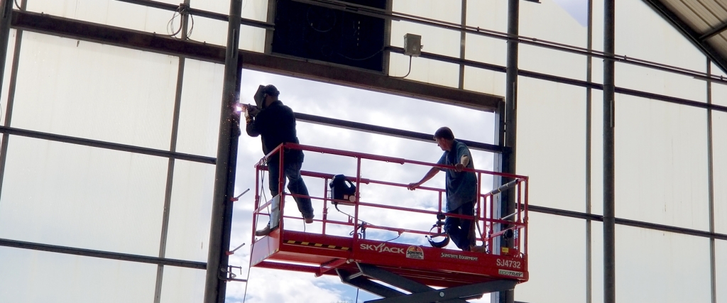 UA welders Charlie and Chad framing in the Mars yard bay doors at Biosphere 2