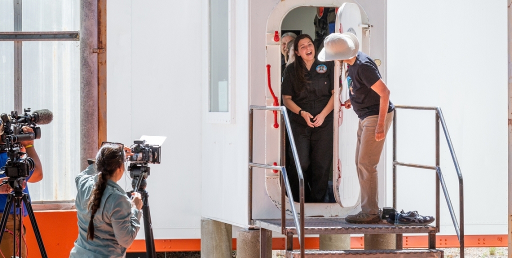 Cassandra Klos is greeted by Linda Leigh upon exit of SAM after six days sealed mission.