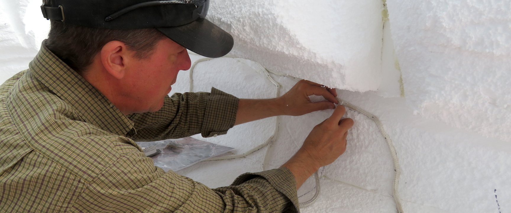 Director of Research for SAM Kai Staats applies nylon rope to define the pathway of gypsum.