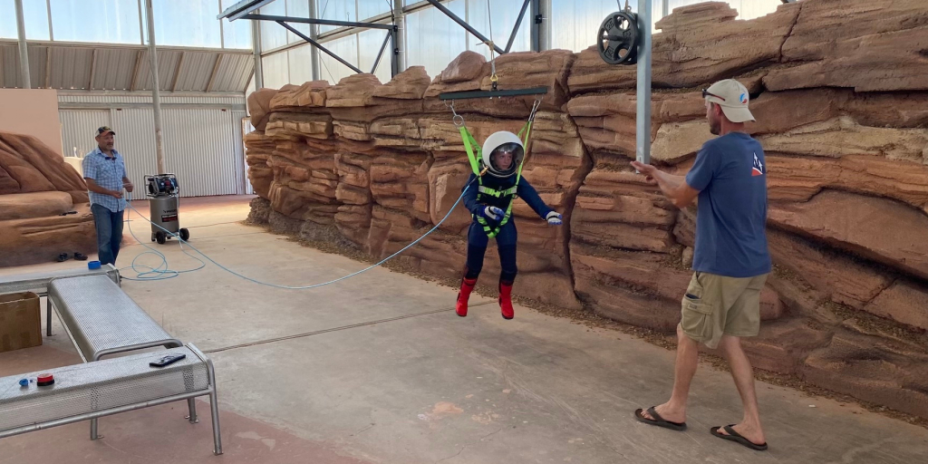 Isaac Reed in a custom pressure suit on the Reduced Gravity Simulator at SAM